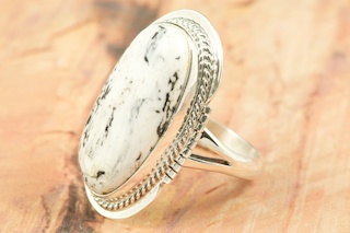 White Buffalo Turquoise set in Sterling Silver Ring. This Beautiful Stone is formed from the minerals Calcite and Iron. It is mined near Tonopah Nevada. Created by Navajo Artist Margaret Platero. Signed by the artist.
